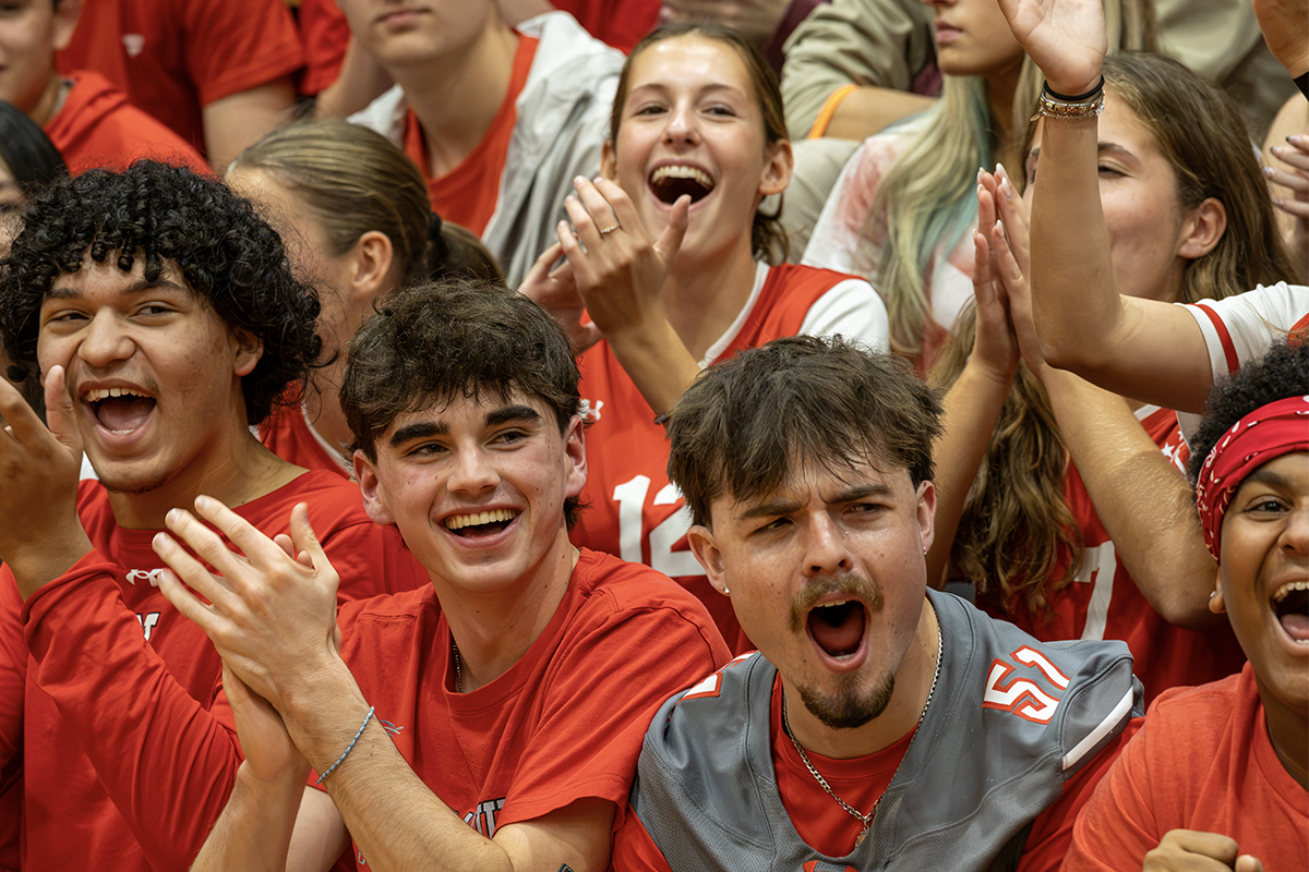 high school students cheer at pep rally