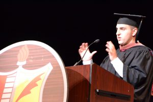 Niskayuna High School graduate Brian Chesky, co-founder and CEO of AirBnb addresses graduates and guests from the podium at graduation in June 2017.