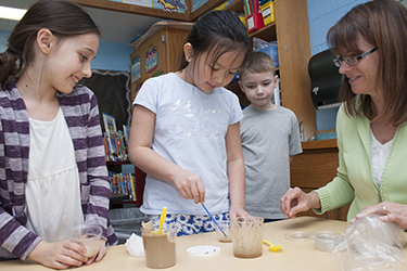 Glencliff teacher Erin McMahon works with a group of four students in her classroom.