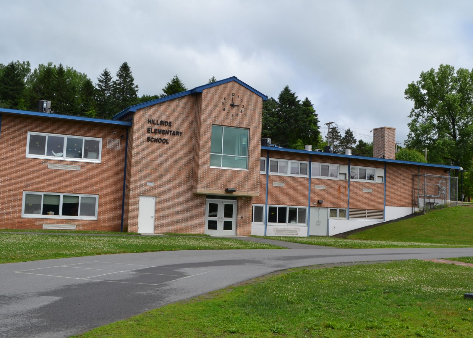 The exterior of Hillside School, looking toward the school from the playground area