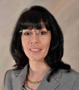 Headshot of Noney Grier smiling at the camera