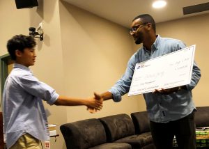 Student accepted a scholarship check