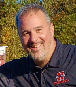 headshot photo of Timothy Brennan