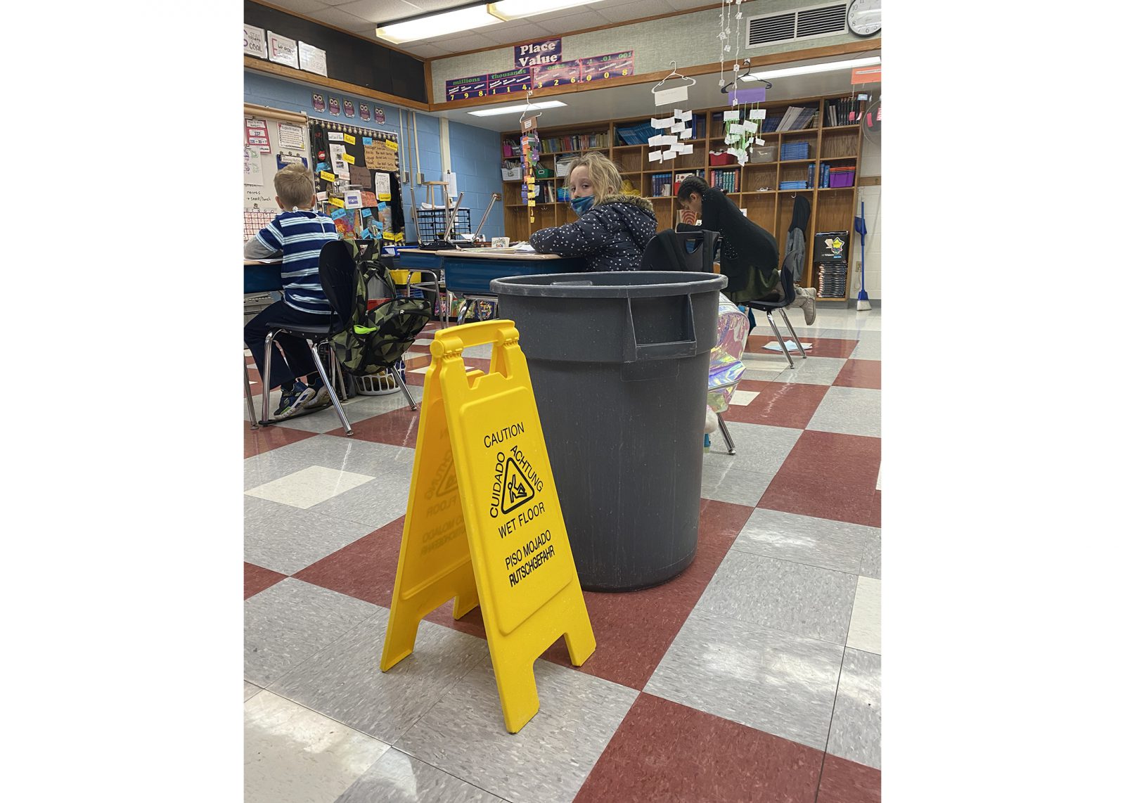 Students in a classroom at Glencliff with water buckets next to them