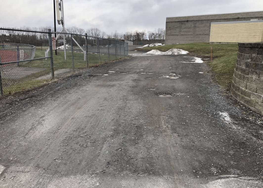 Image showing the unfinished roadway around the back of the high school by the stadium