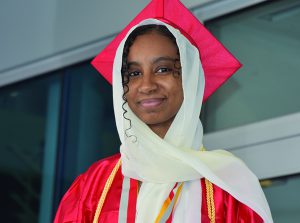 photo of a student at graduation in a cap and gown