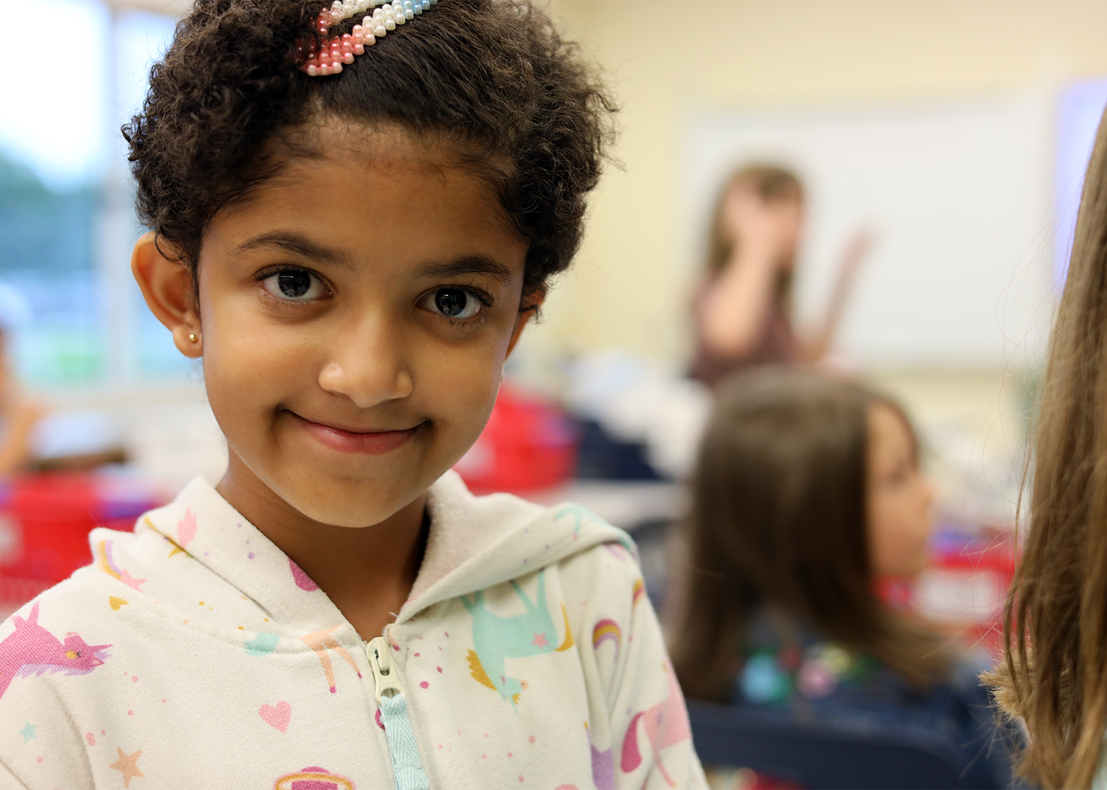 student smiles at camera