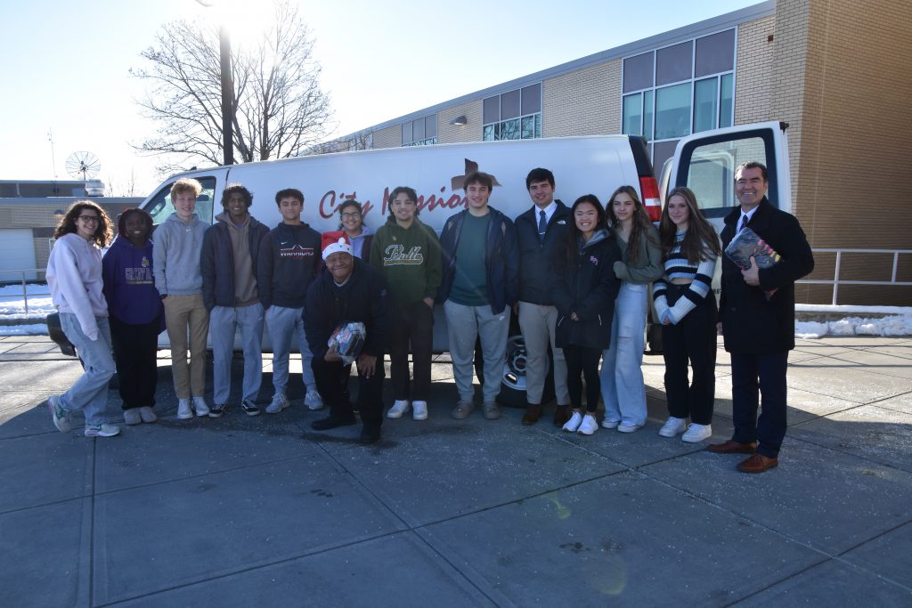 Students with representatives from the City Mission
