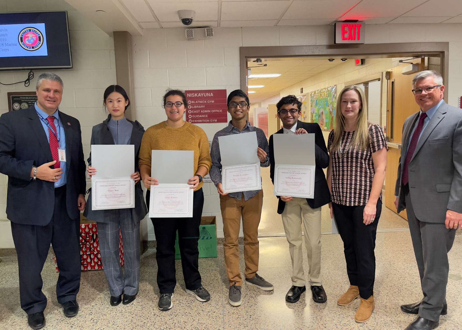 Students stand with Board of Ed members