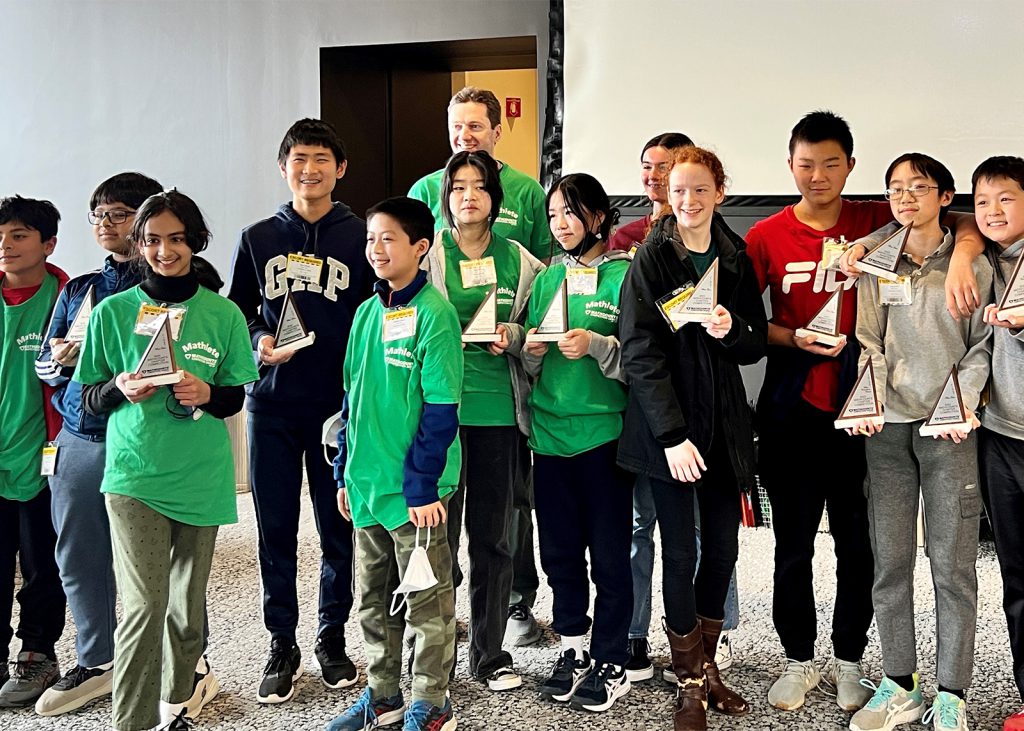 groups of mathletes holding trophies