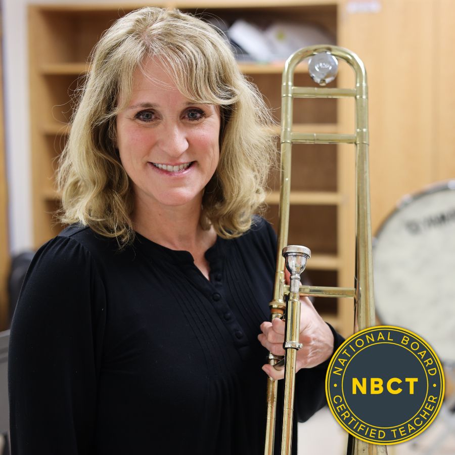 Susan Kokernak with Trombone and National Board Certificated Teacher logo