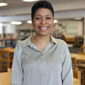 Tishawn Terry-Garcia standing in library