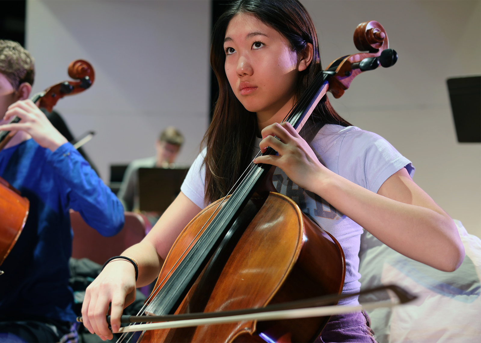 student playing cello on stage