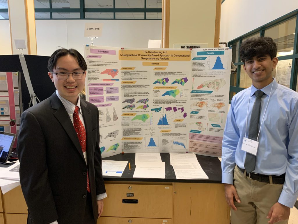 James Lian and Arin Khare standing with their project