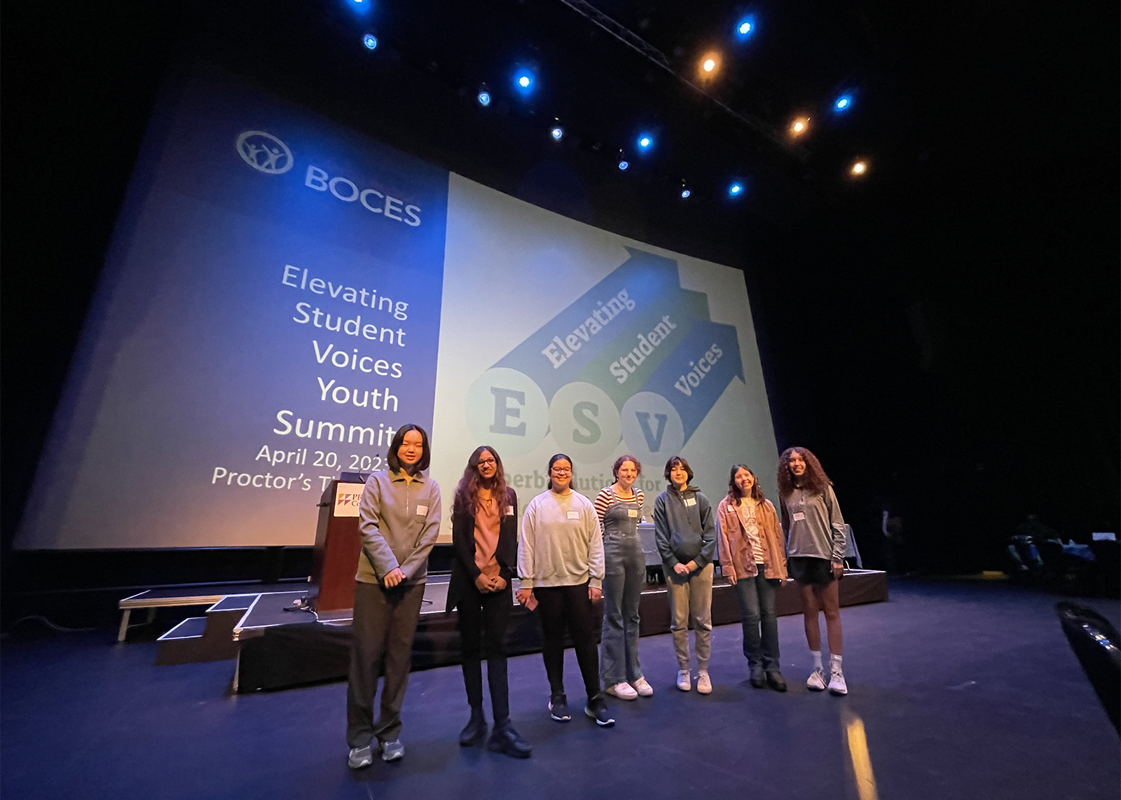 students on stage at a youth summit