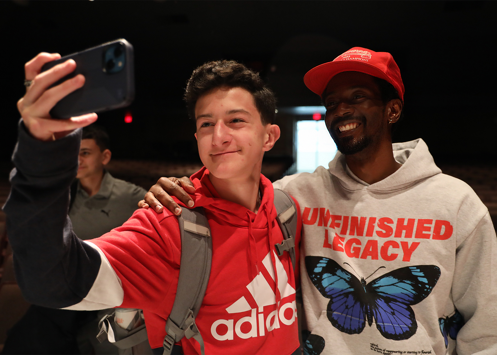 award winning author takes selfie with student