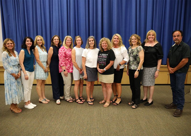 Retired staff gather for a photo