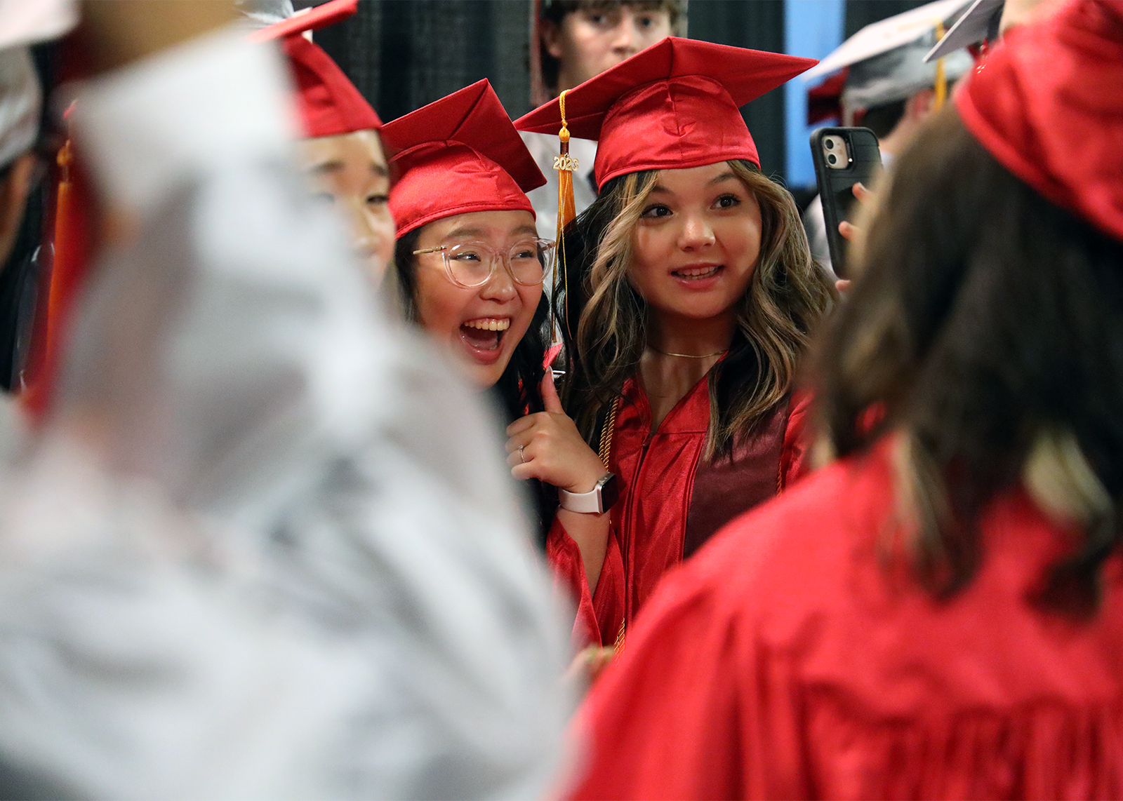 excited graduate give thumbs up during selfie
