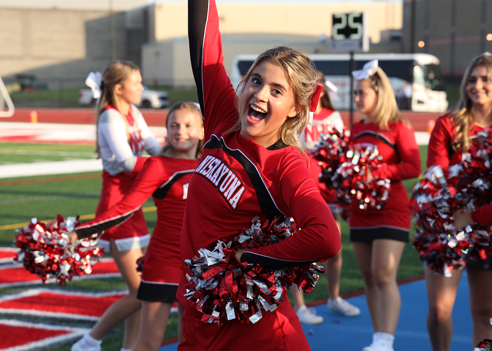 cheerleader smiling at camera in uniform