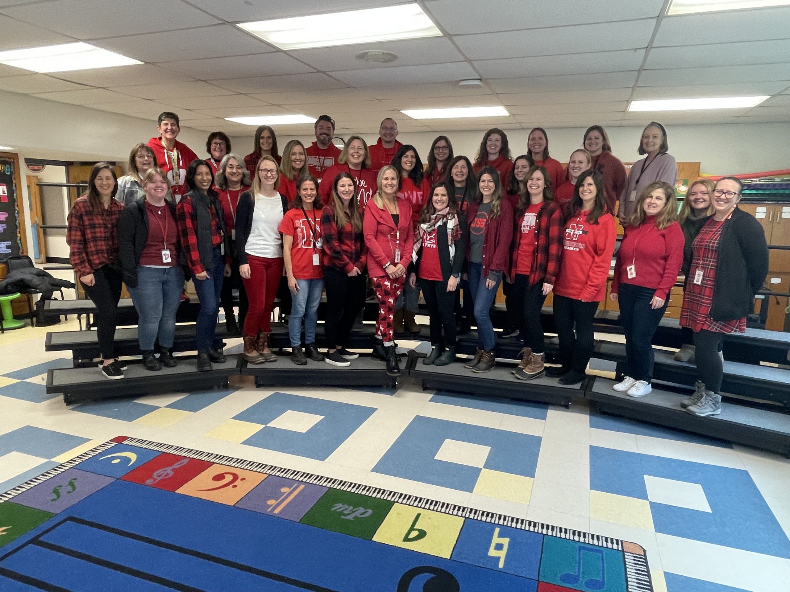 Birchwood Elementary School faculty and staff wear red and gather for a photo in support of 4th grader Jack Salinetti, who is fighting leukemia.