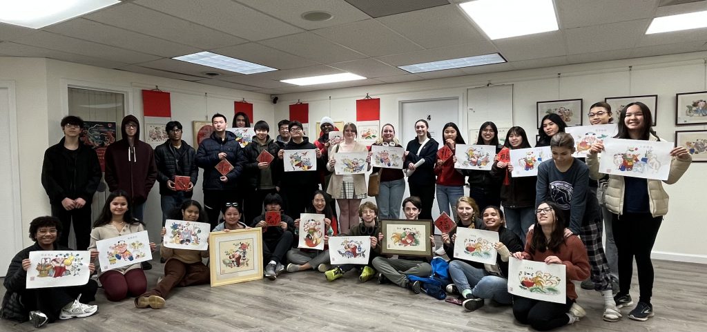 NHS students display Lunar New Year paintings at Chinese Community Center.