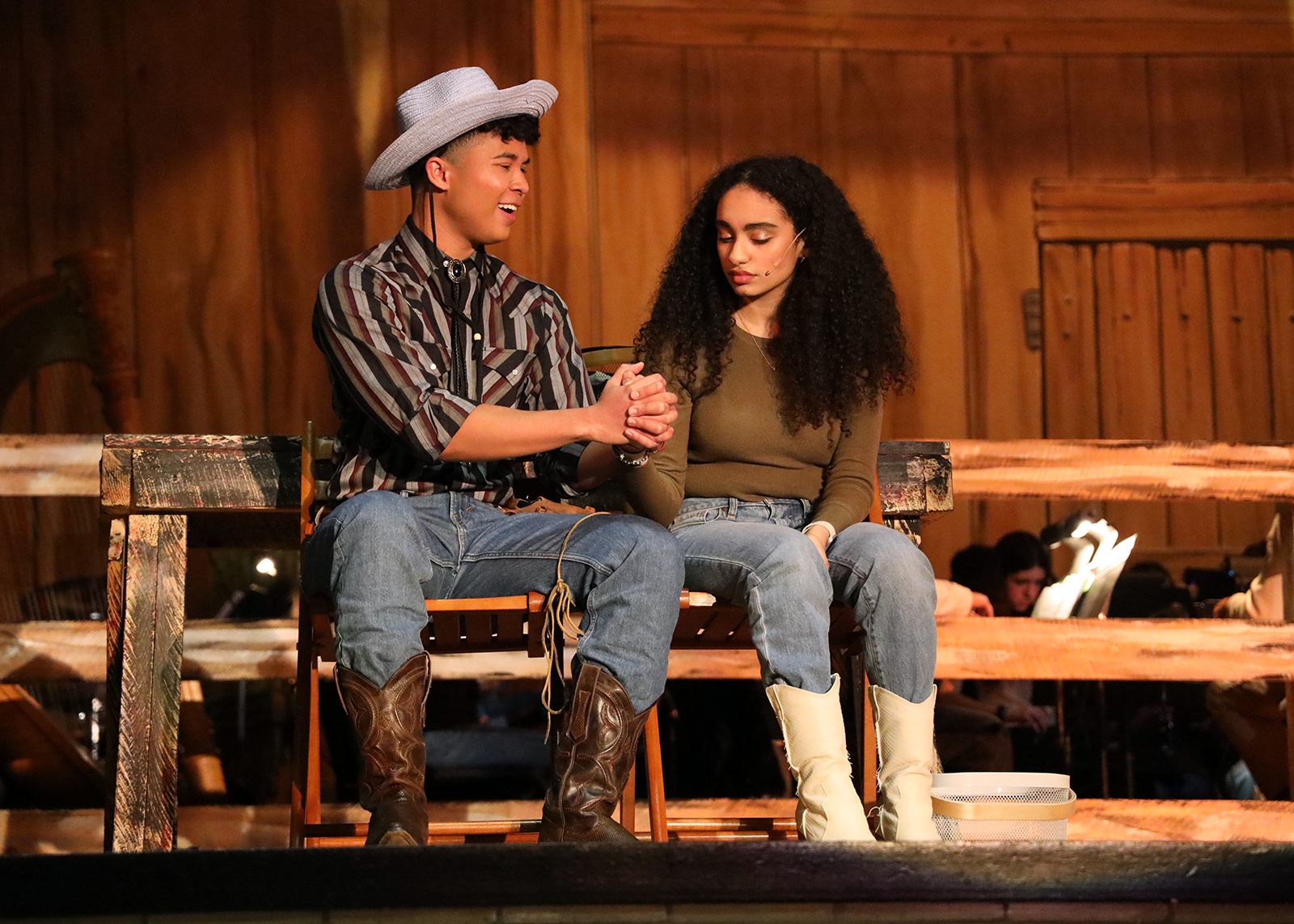 students practicing for the play on stage