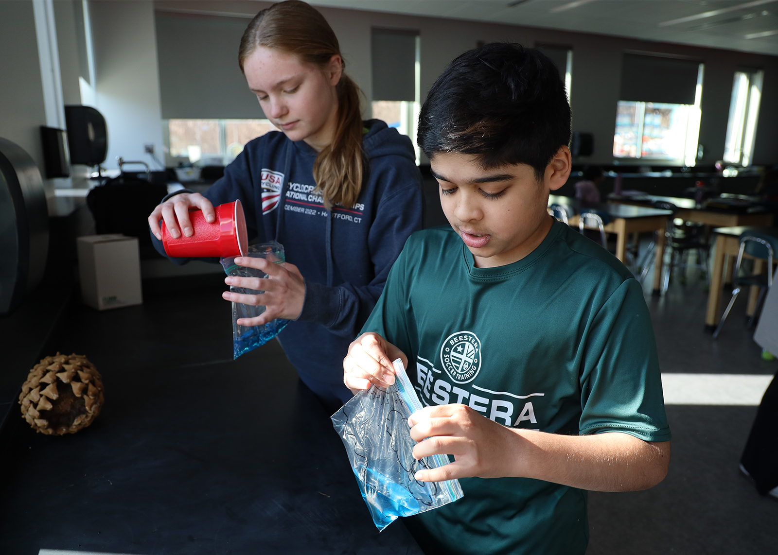students work on a science project