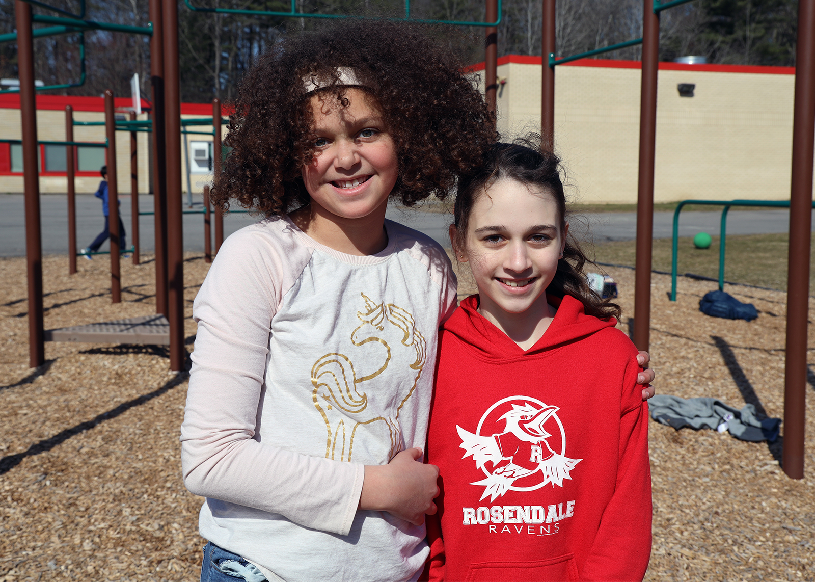 students smiling on the playground
