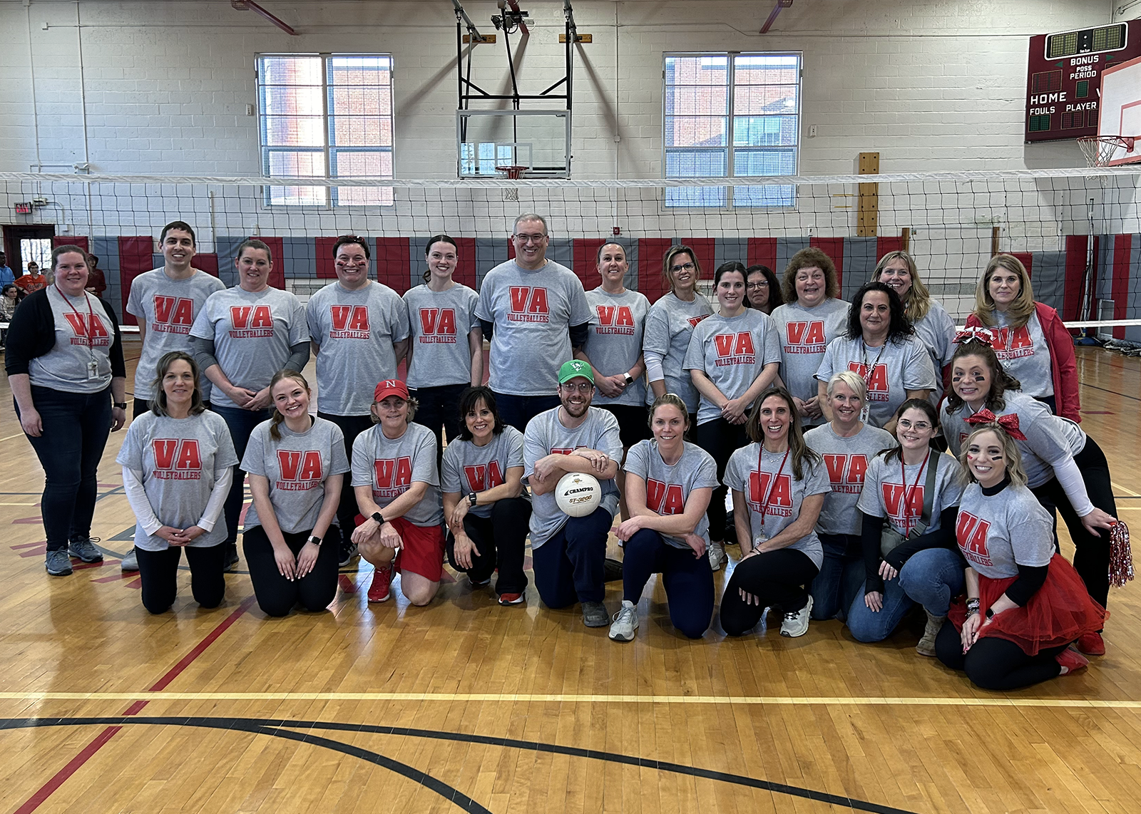 VA faculty group photo at volleyball event
