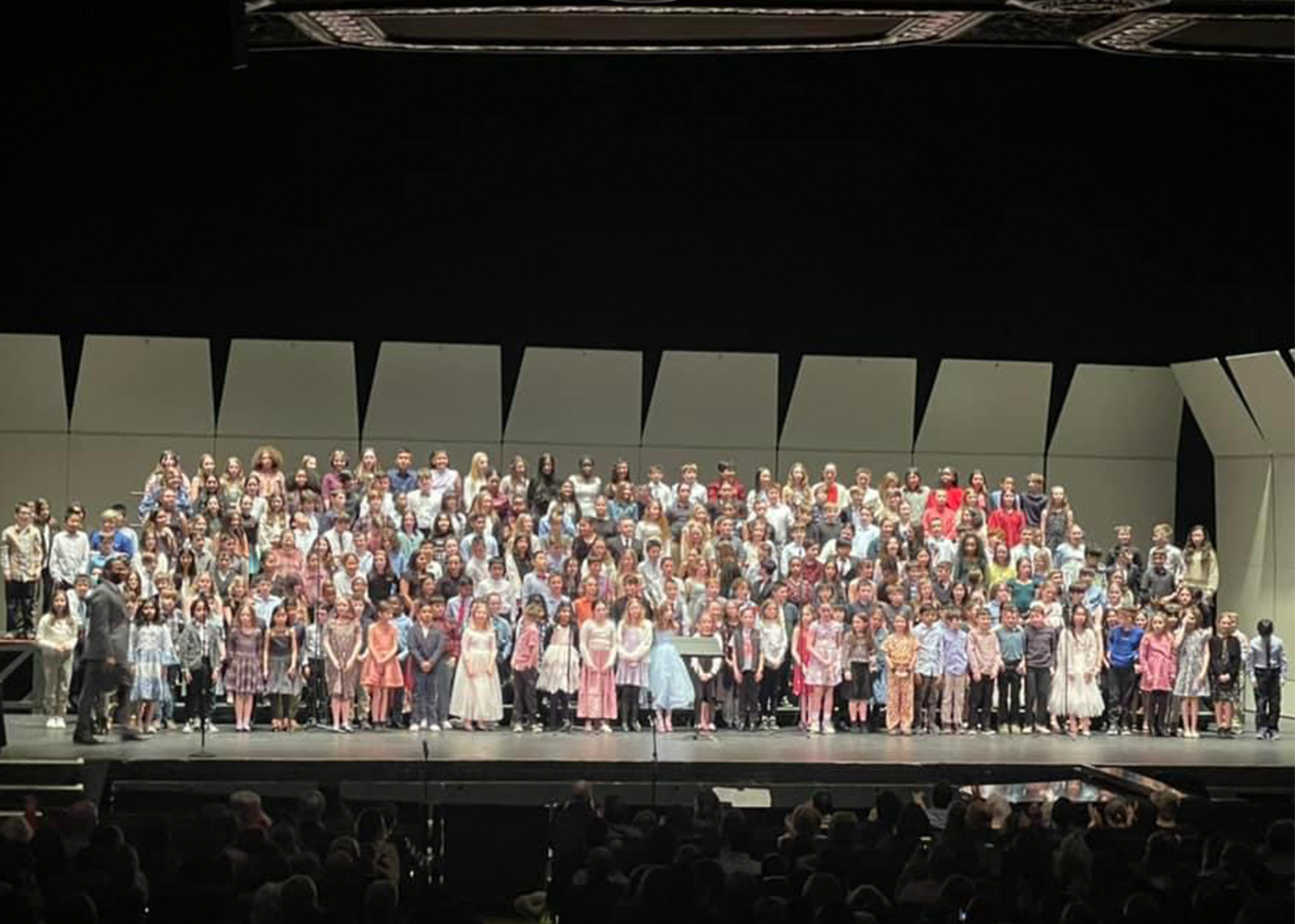 Students assembled on stage for a performance