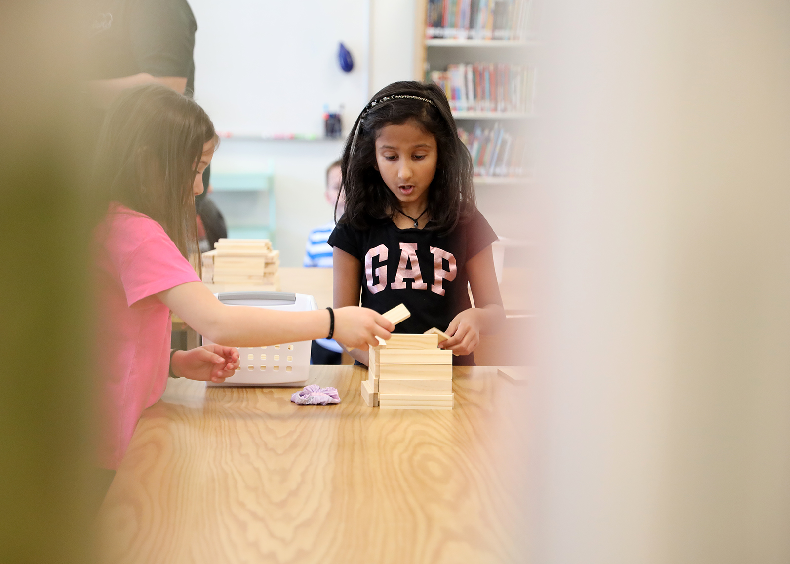 students stacking Keva blocks