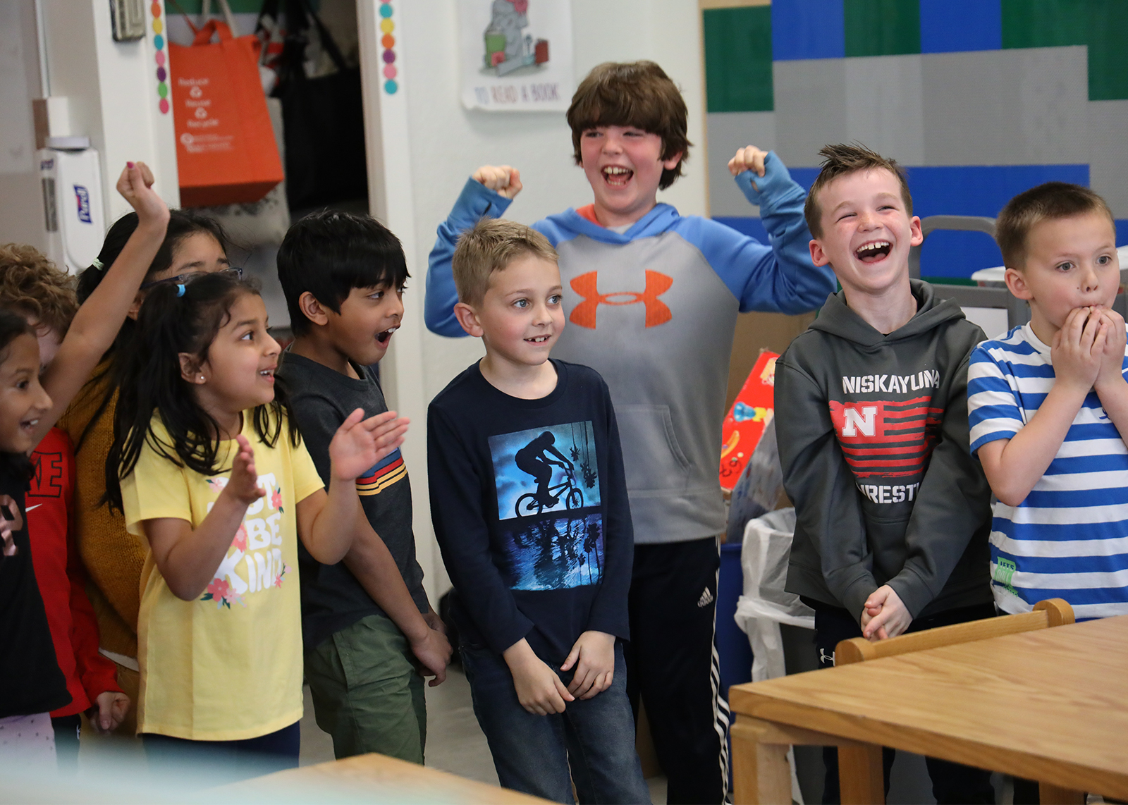 students laughing in library