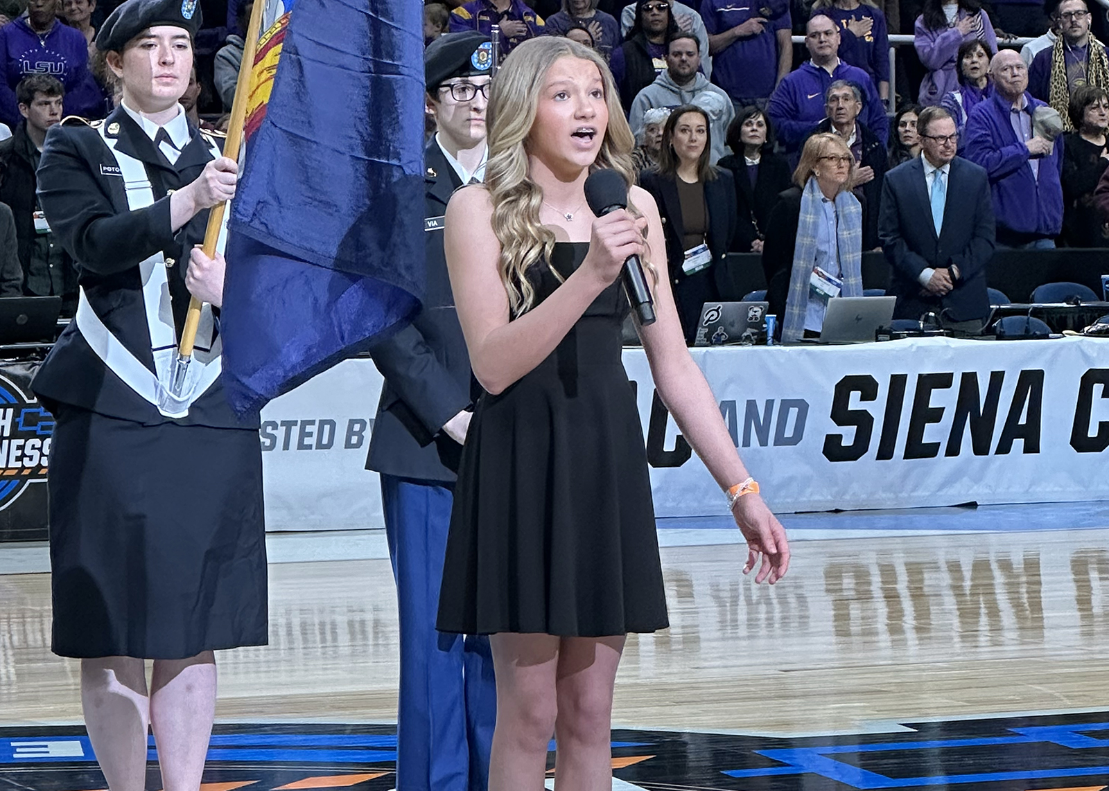 student sings national anthem at NCAA tournament