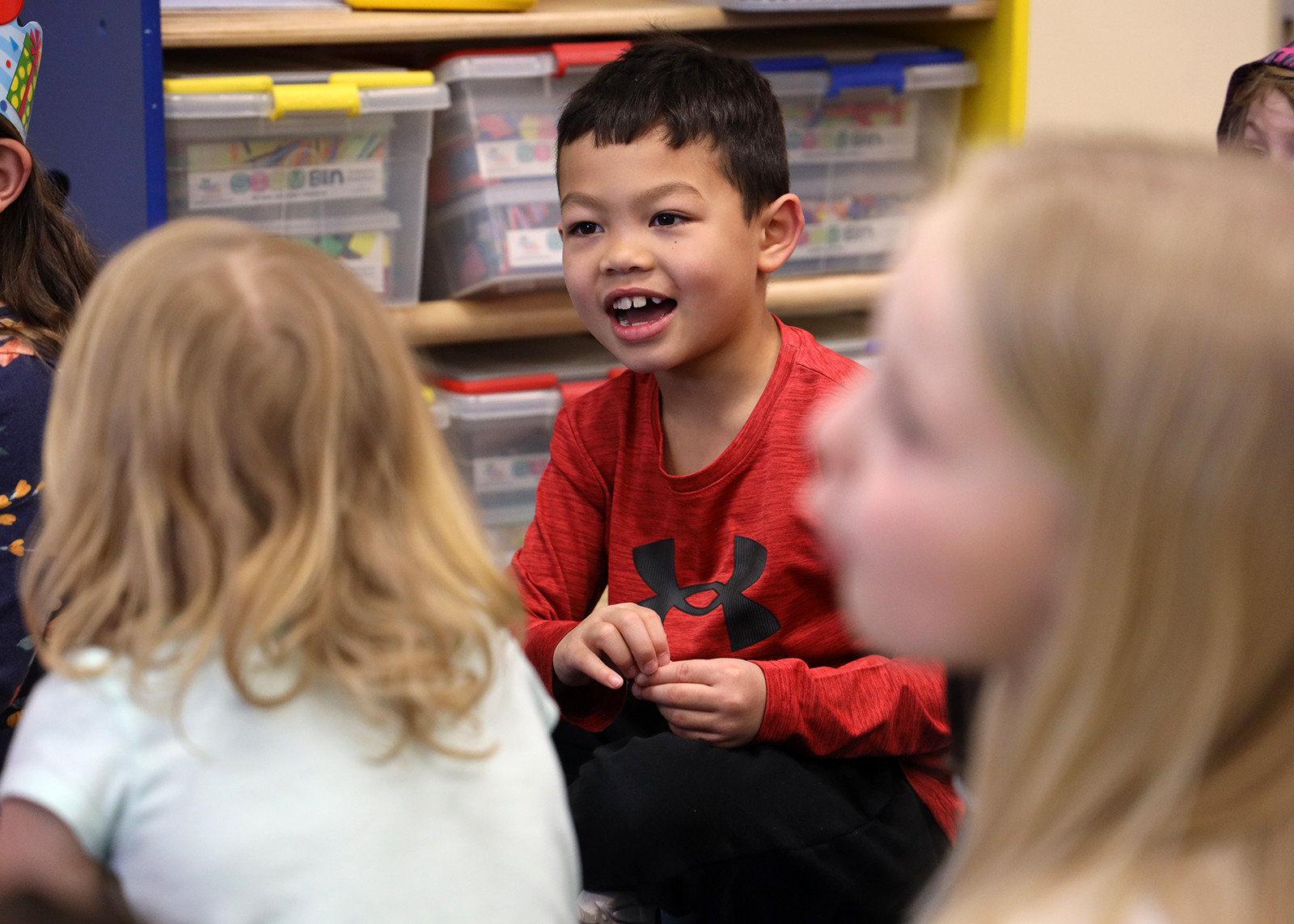 student smiling at story time