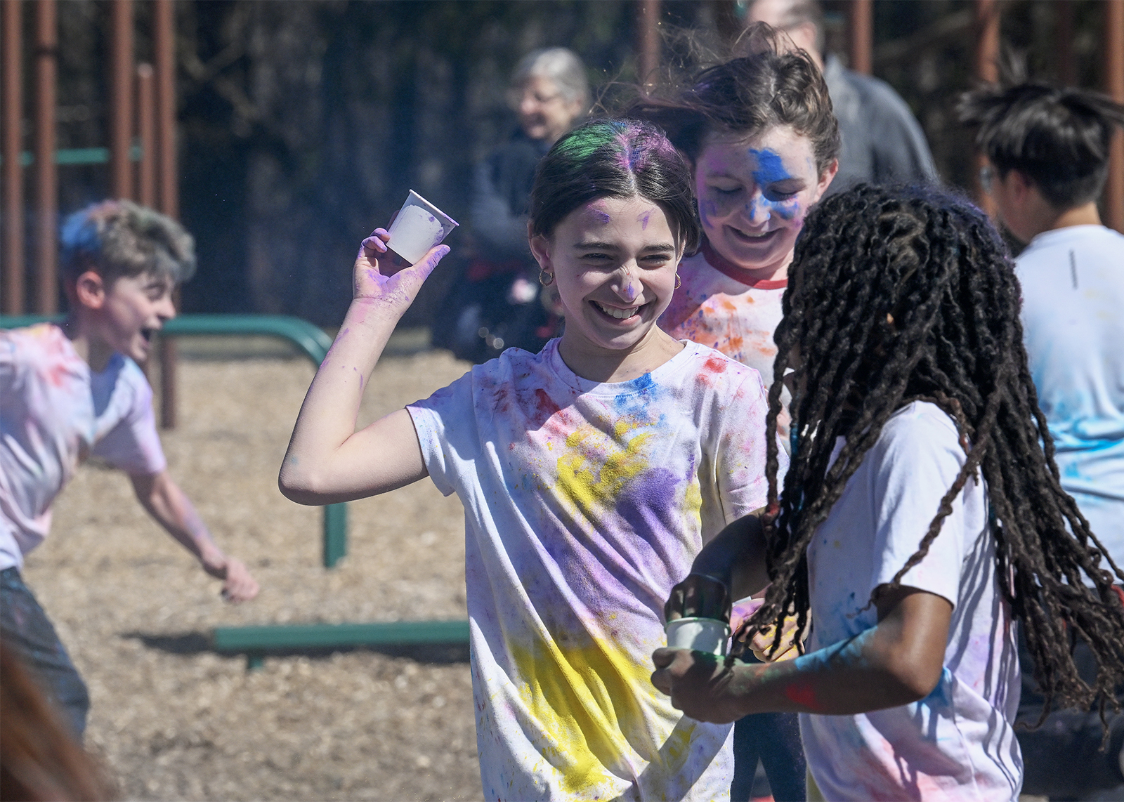 student celebrating Holi with colored powder
