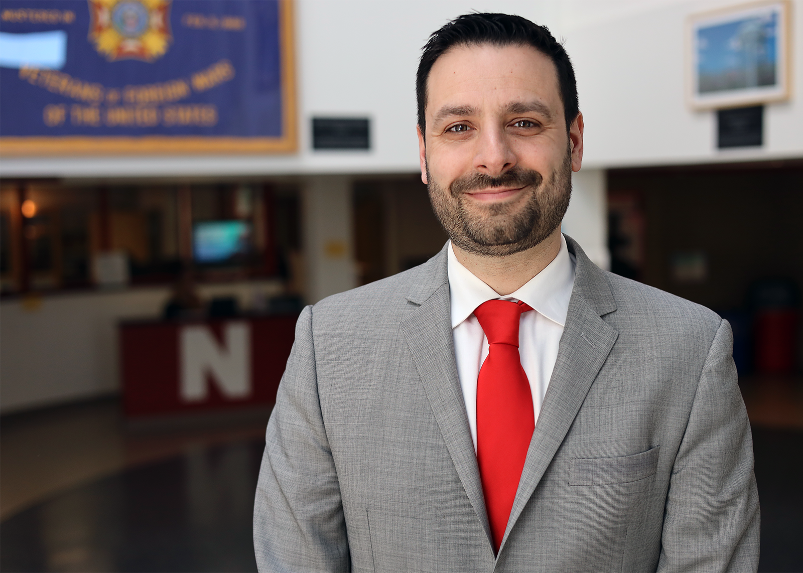 principal in hallways smiling