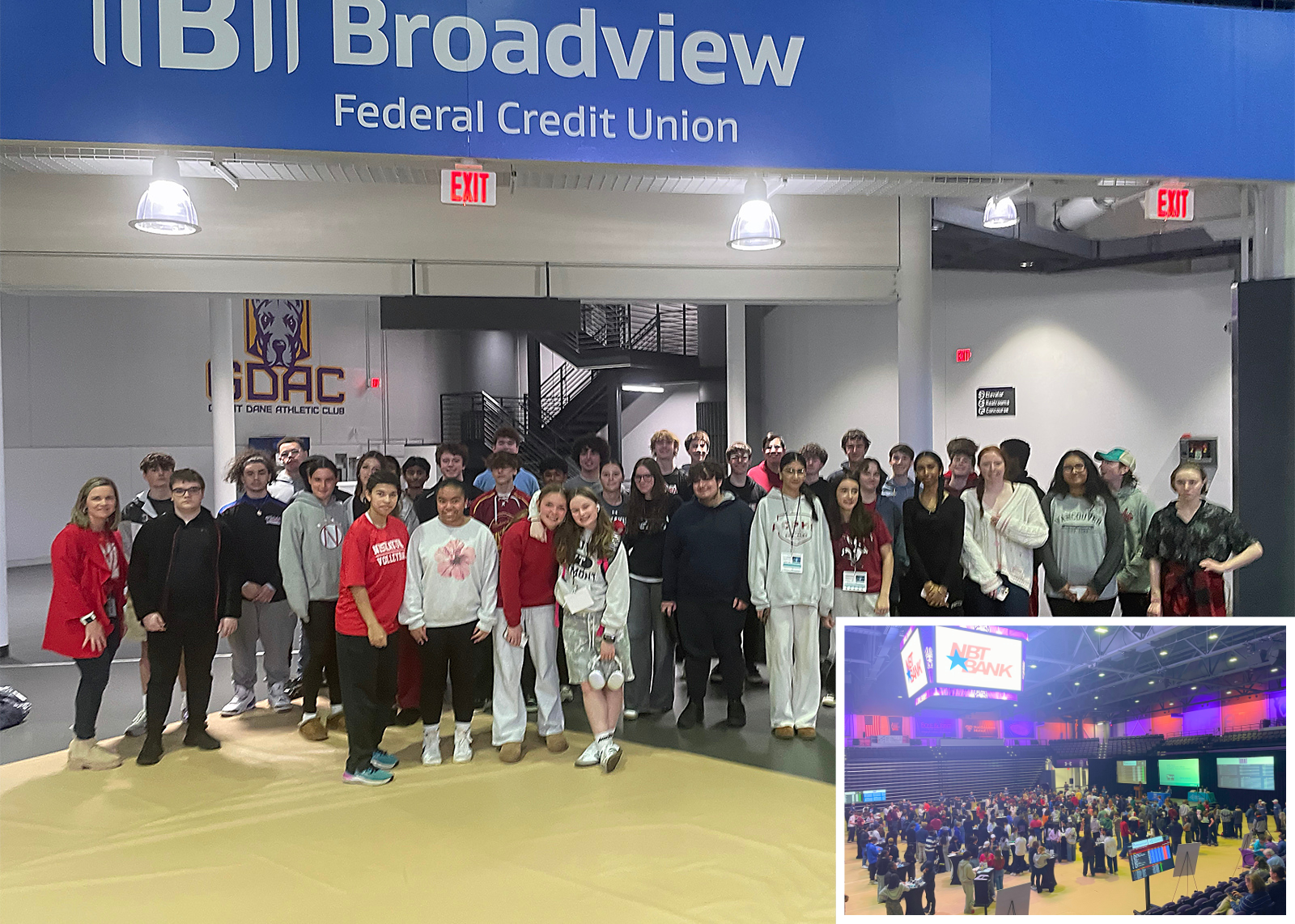 group photo of business students with inset picture of mock stock market