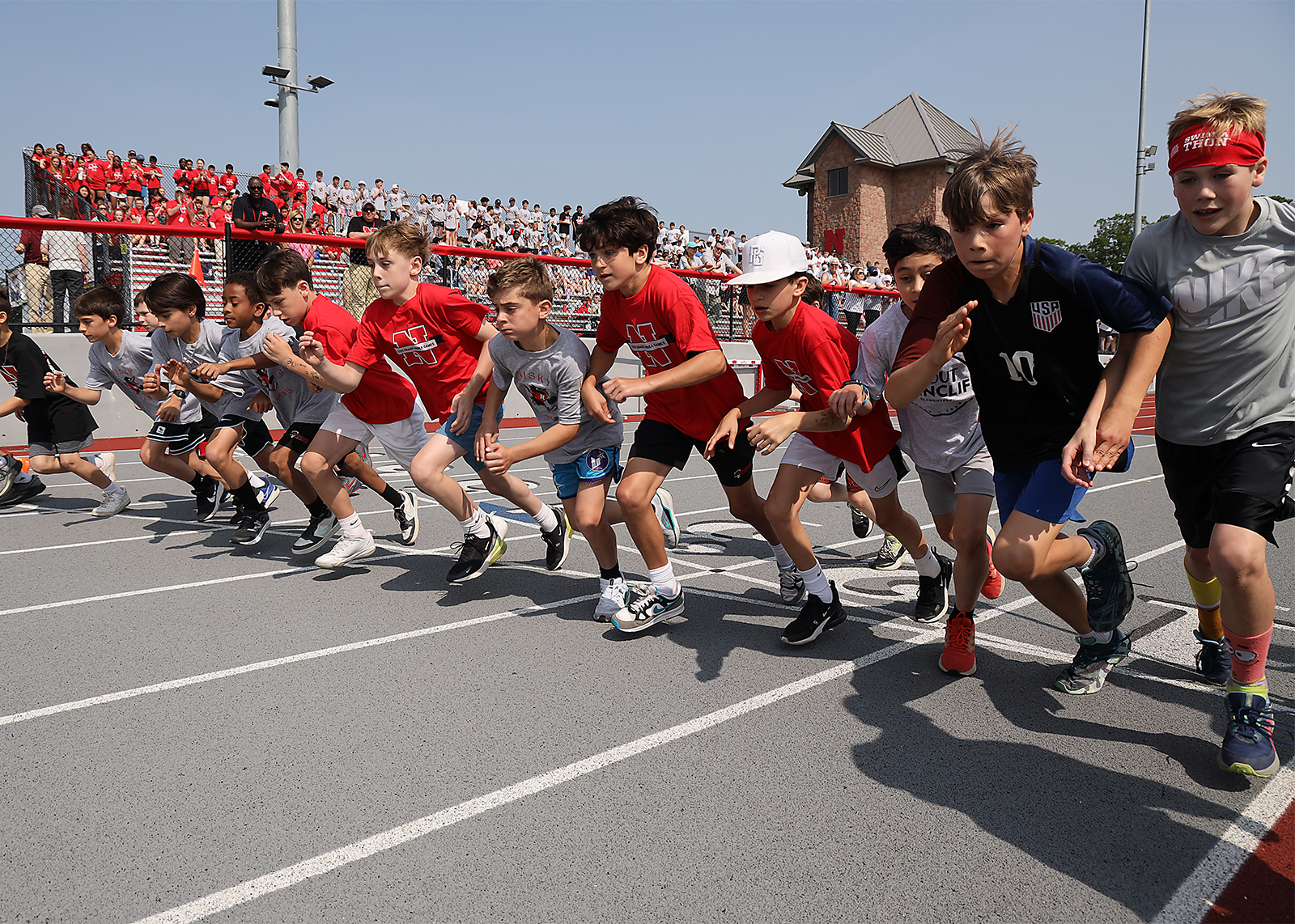 elementary students starting a race on track