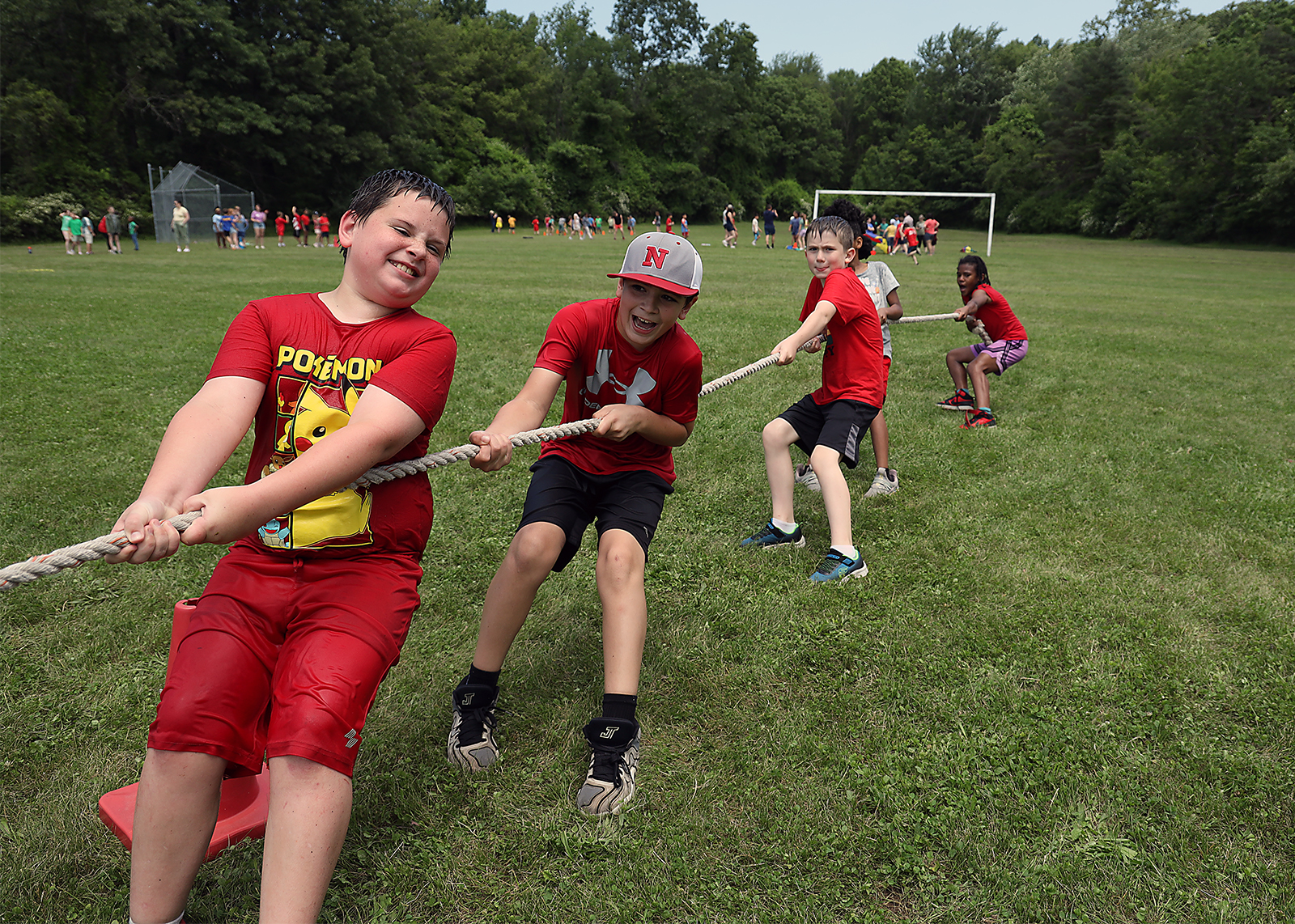 elementary students playing tug of war