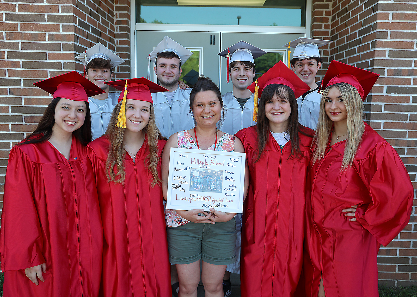 group of seniors with their first grade teacher