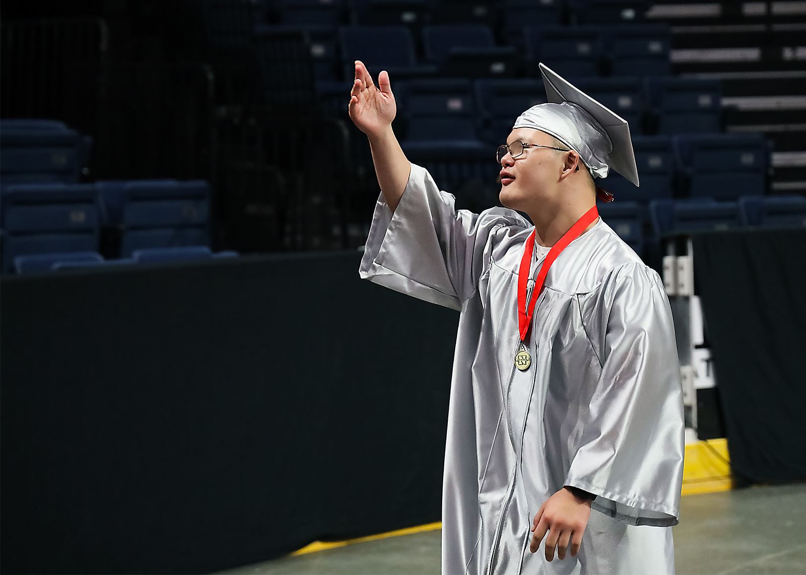 graduate blows kiss to family in the stands