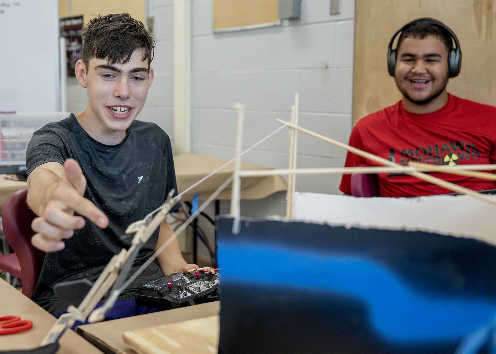 teammates test a project at engineering camp