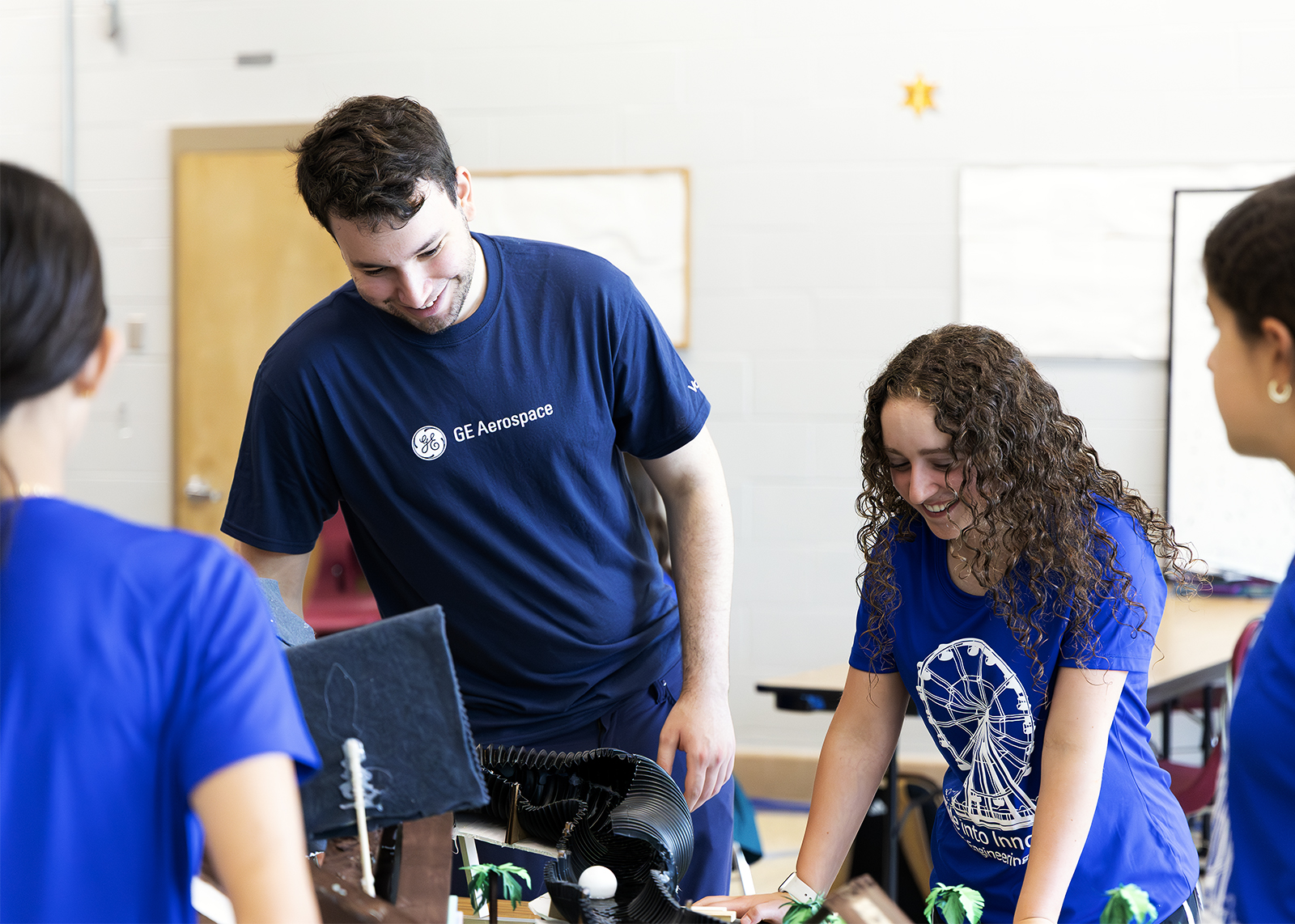 GE partner working with students on STEM camp project