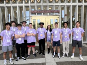 Ten Niskayuna music students standing outside in front of a performing arts center