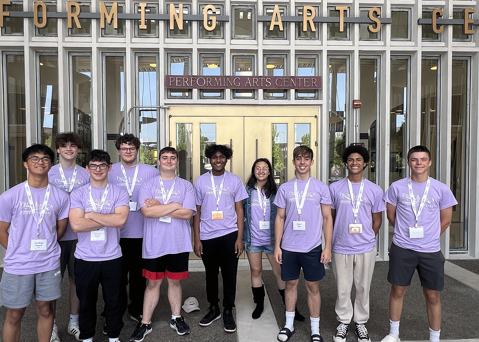 Ten Niskayuna music students standing outside in front of a performing arts center