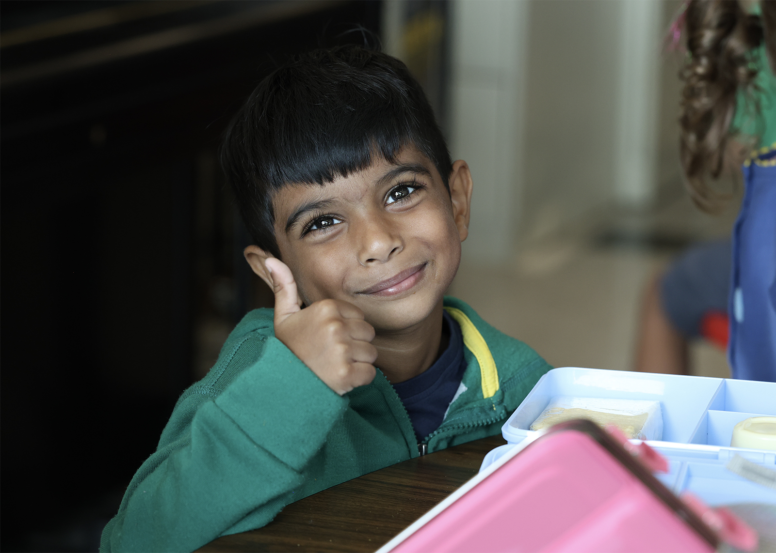 kinder student give thumps up