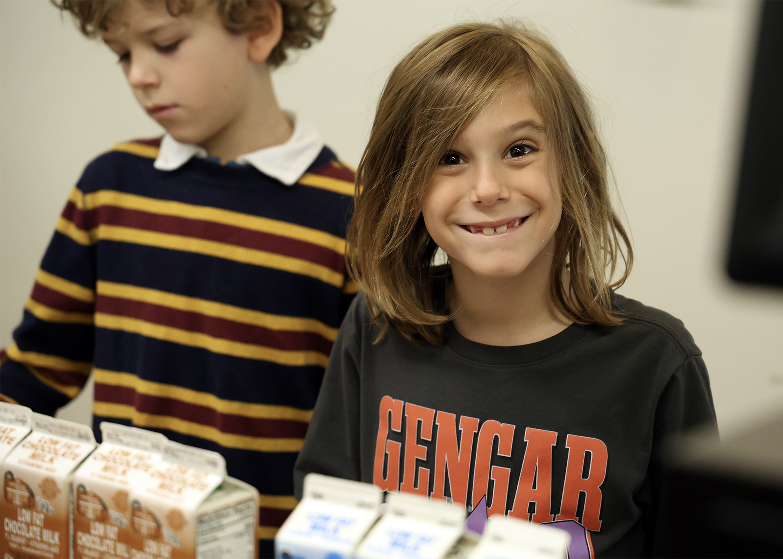 silly smile from an elementary student in lunch line