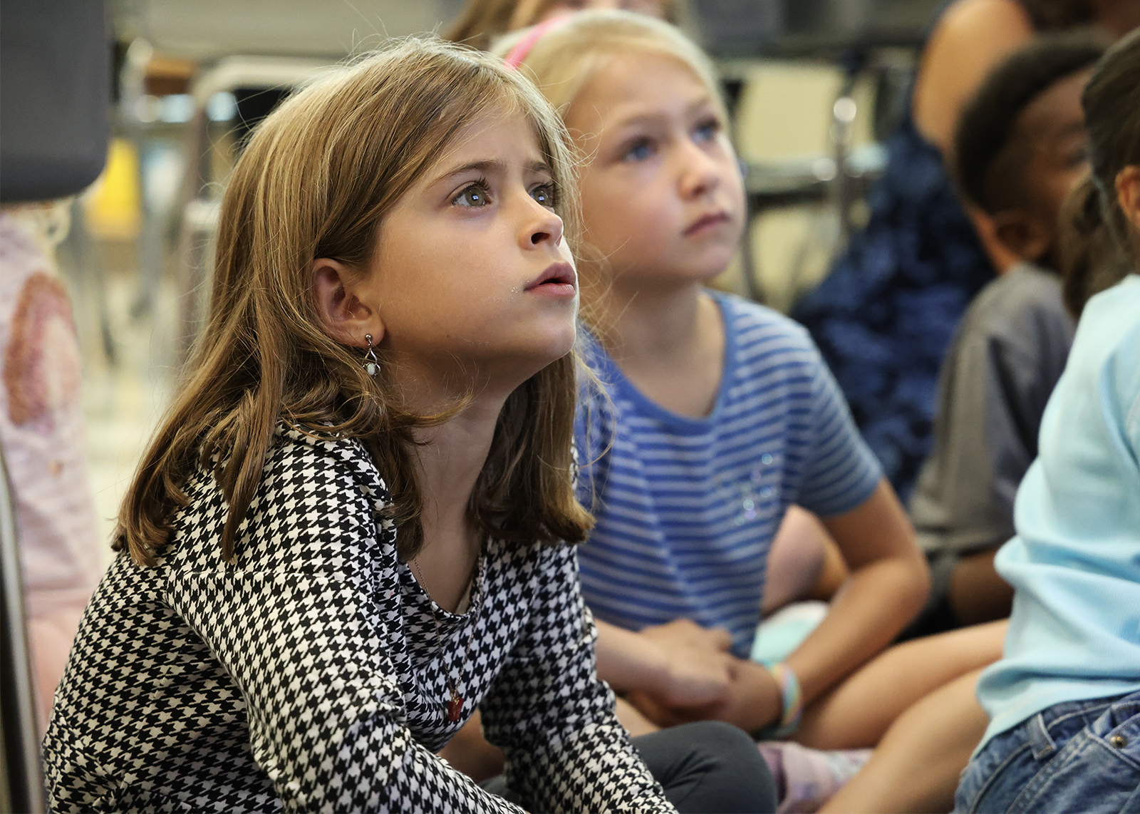 students looks up a lesson in class