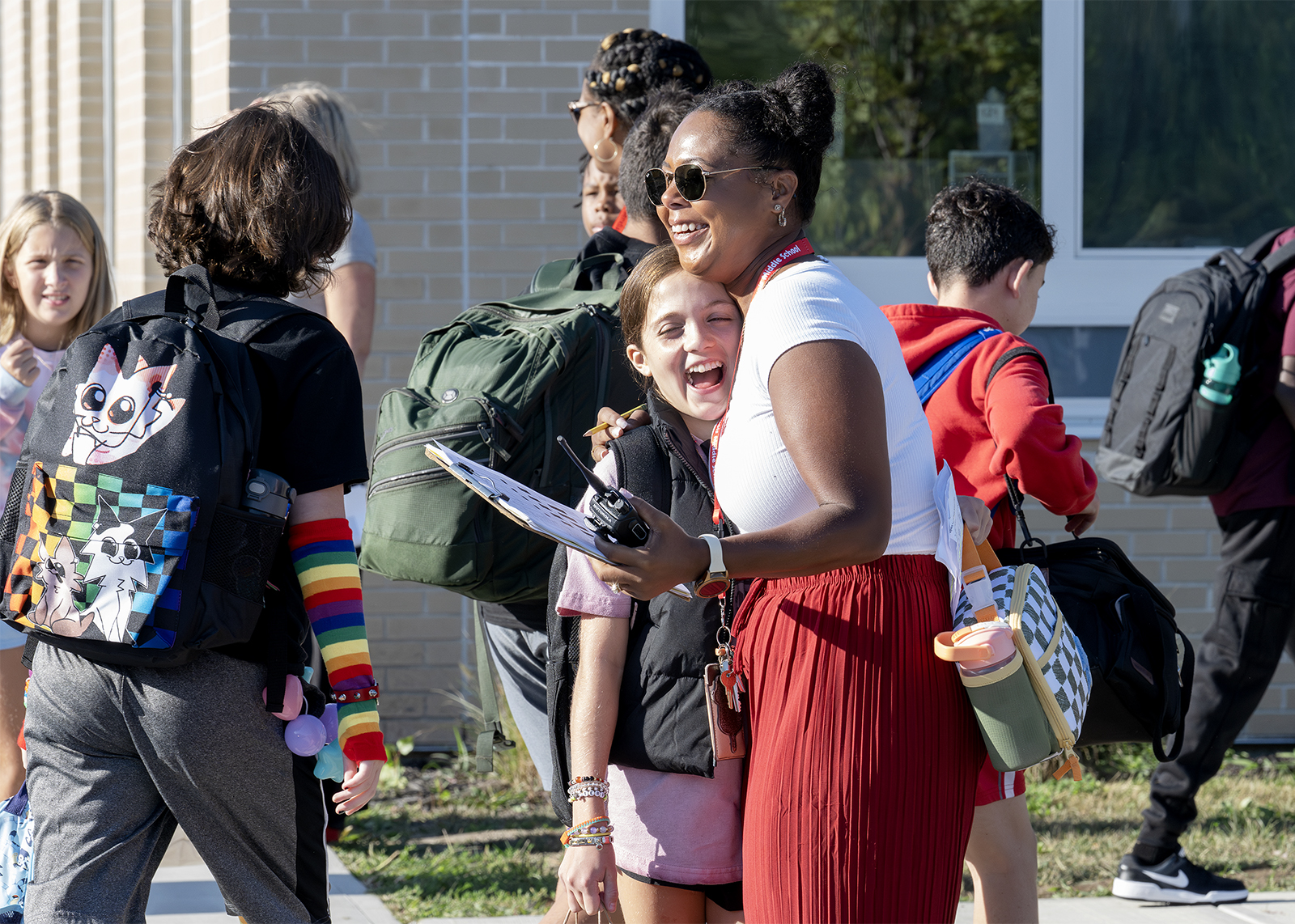 middler schooler hugs staff on first day