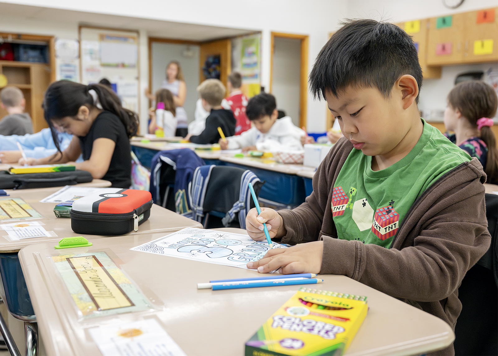 student works on first day of school activity